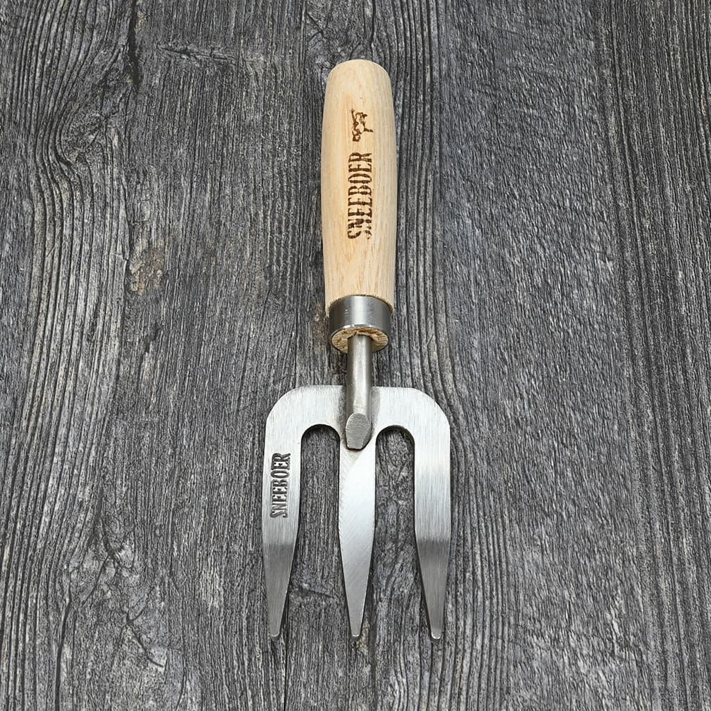 Sneeboer Children’s Garden Hand Fork on table