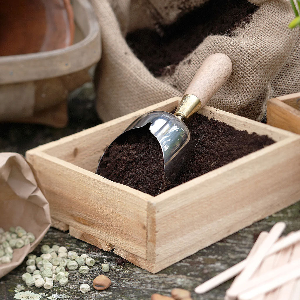 Sophie Conran Compost Scoop by Burgon & Ball in use