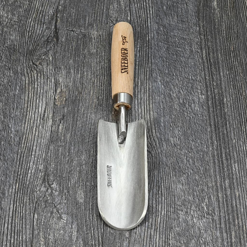 Sneeboer Children’s Garden Hand Trowel on table