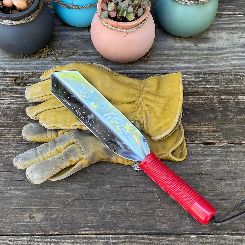 Garden Digging Trowel by Wilcox on garden table