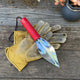 Fine Point Digging Trowel by Wilcox on garden table