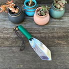 Gator Digging Trowel by Wilcox on garden table