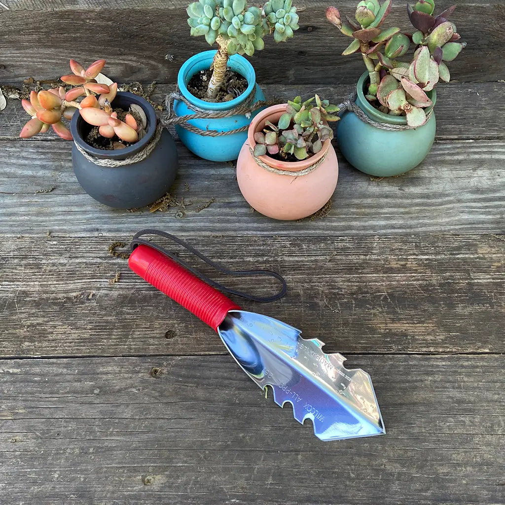 Side Cutter Garden Trowel by Wilcox on garden table